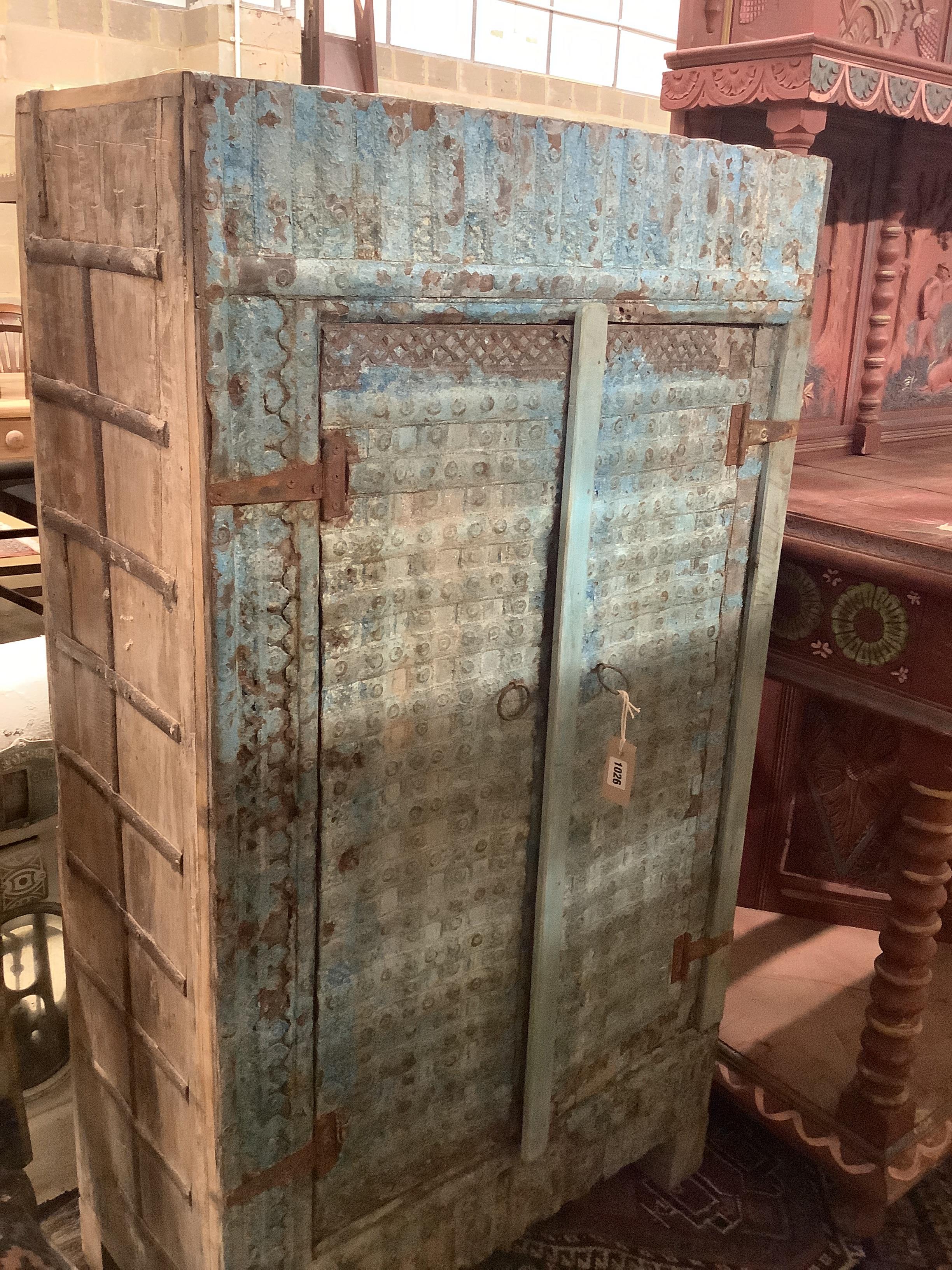 An Eastern painted two door cabinet, width 72cm, depth 35cm, height 131cm